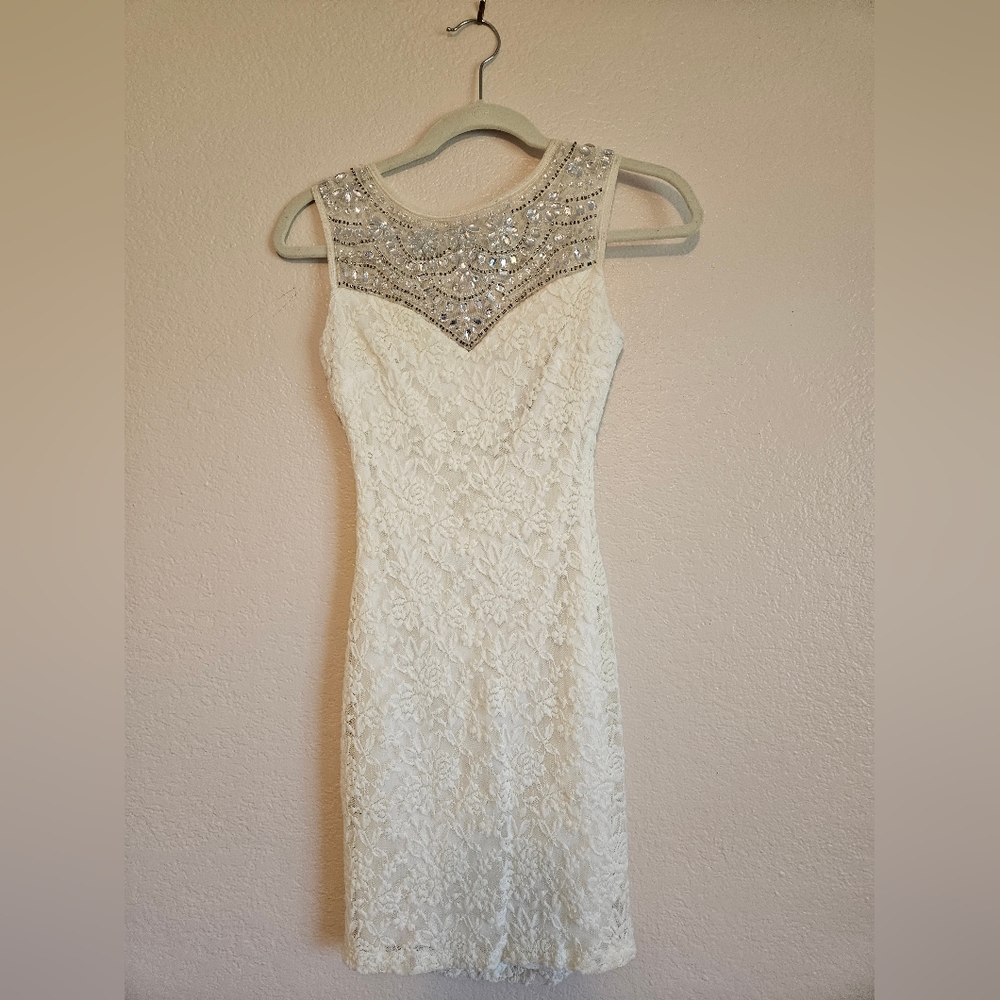 White lace dress with gem neckline